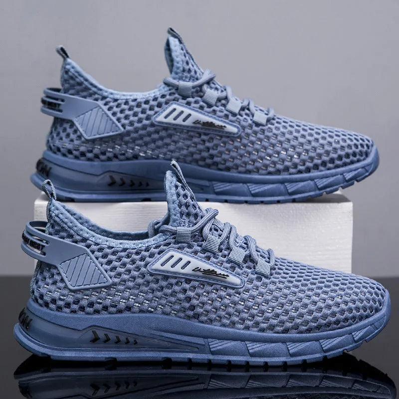 Men's beige mesh sneakers with synthetic leather upper and lace-up front on a white background