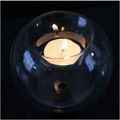 Round clear hollow glass candle holder for hot glass craft on a table