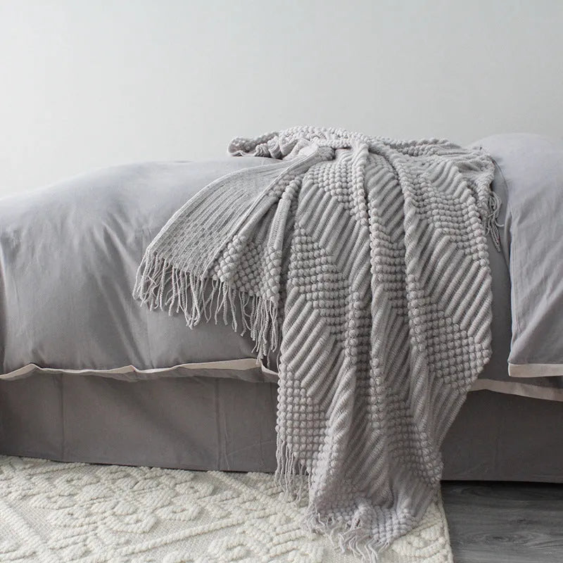 Small grey polyester nap blanket folded to show its 127x170cm size