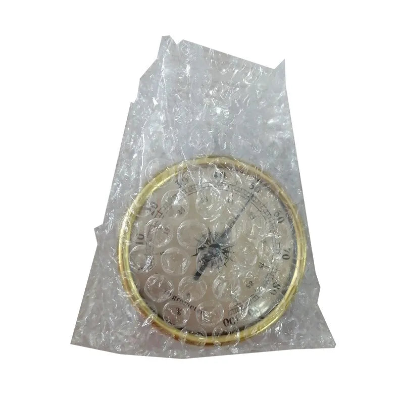 Analogue thermometer and hygrometer with aluminium casing showing temperature and humidity readings