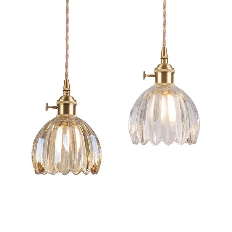 Nordic style bedside chandelier with a glass flower shade in amber, on a white background.