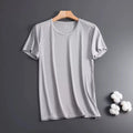 Man wearing a solid colour ice silk short sleeve t-shirt with a loose crew neck fit