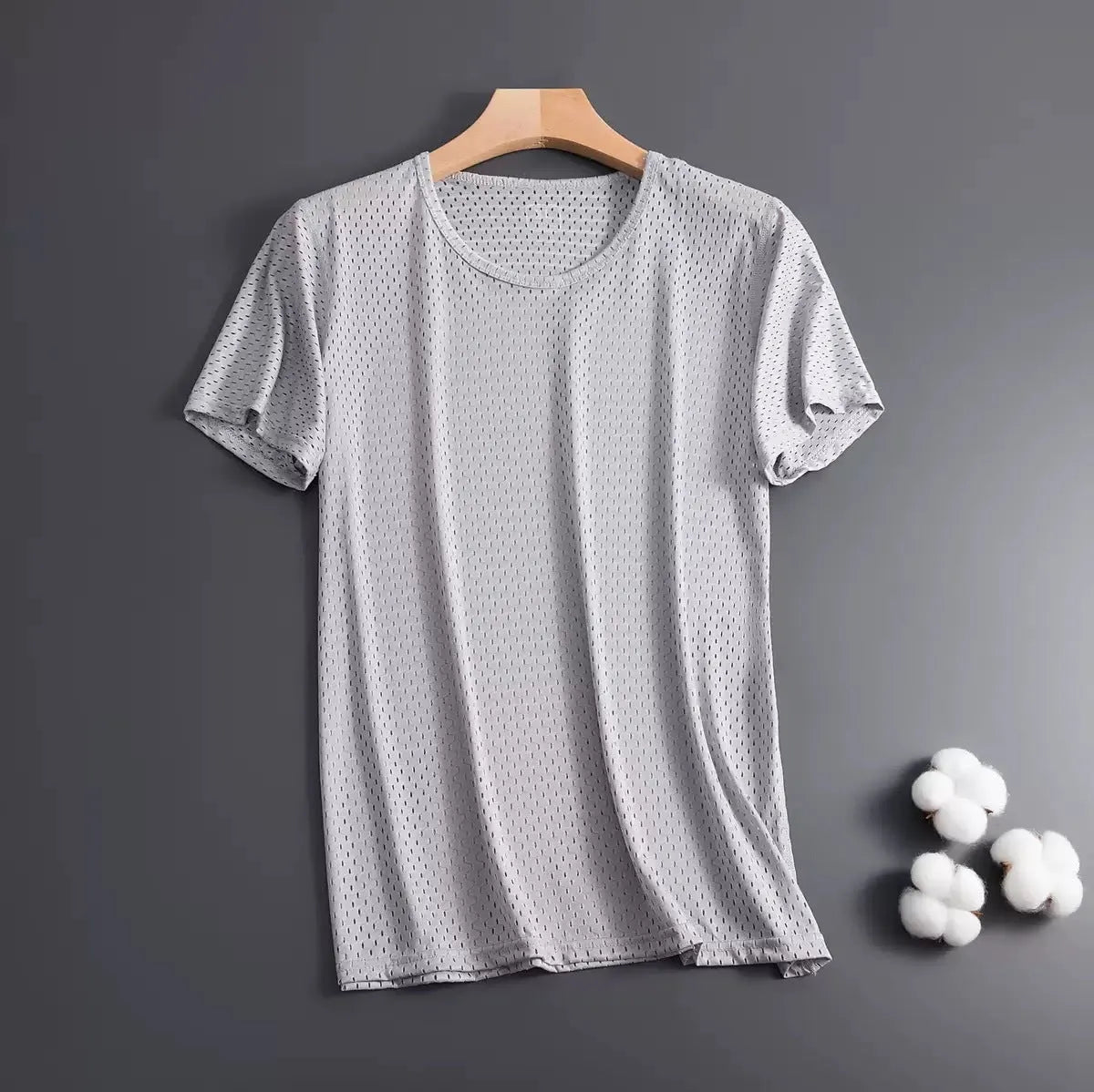 Man wearing a solid colour ice silk short sleeve t-shirt with a loose crew neck fit