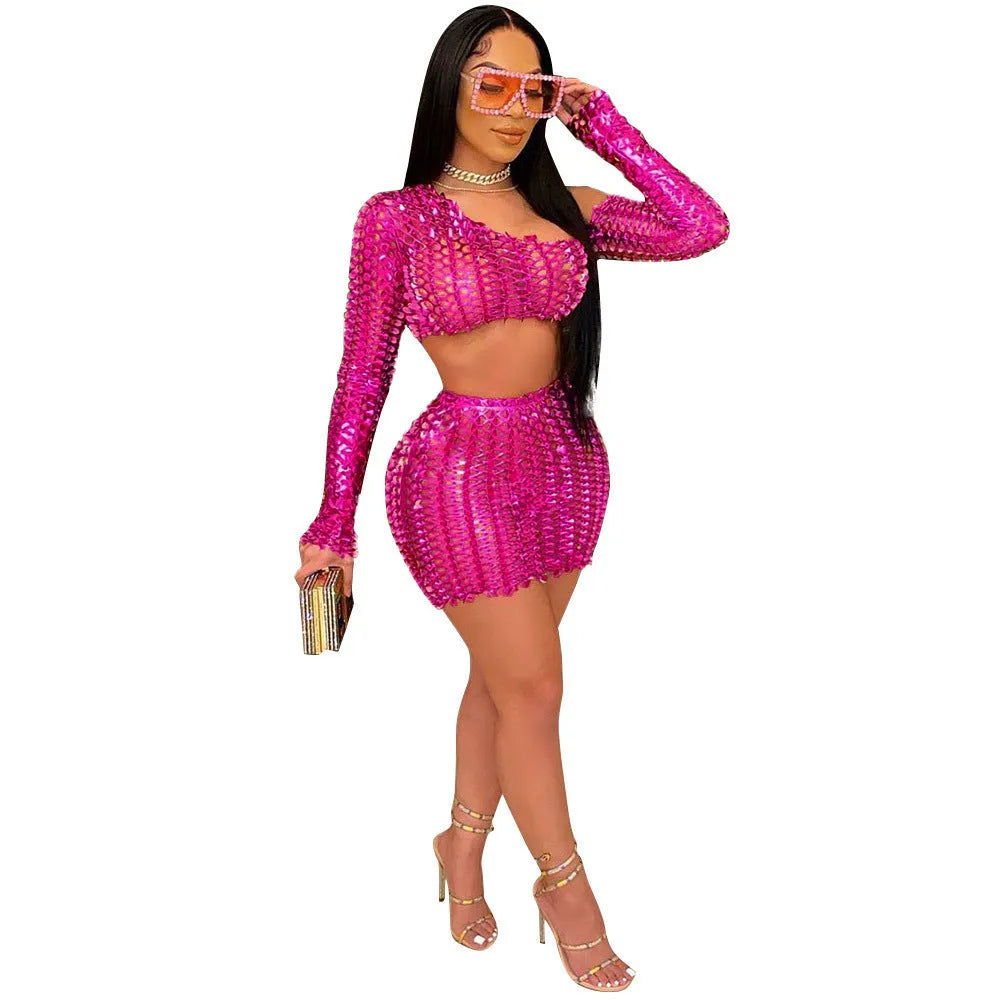 Women's black two-piece dress set with sleeveless hollow-out net top and matching short skirt.