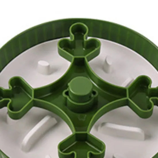 Rotating pet slow feeder bowl with silicone anti-choke pad in blue, showing game board texture.