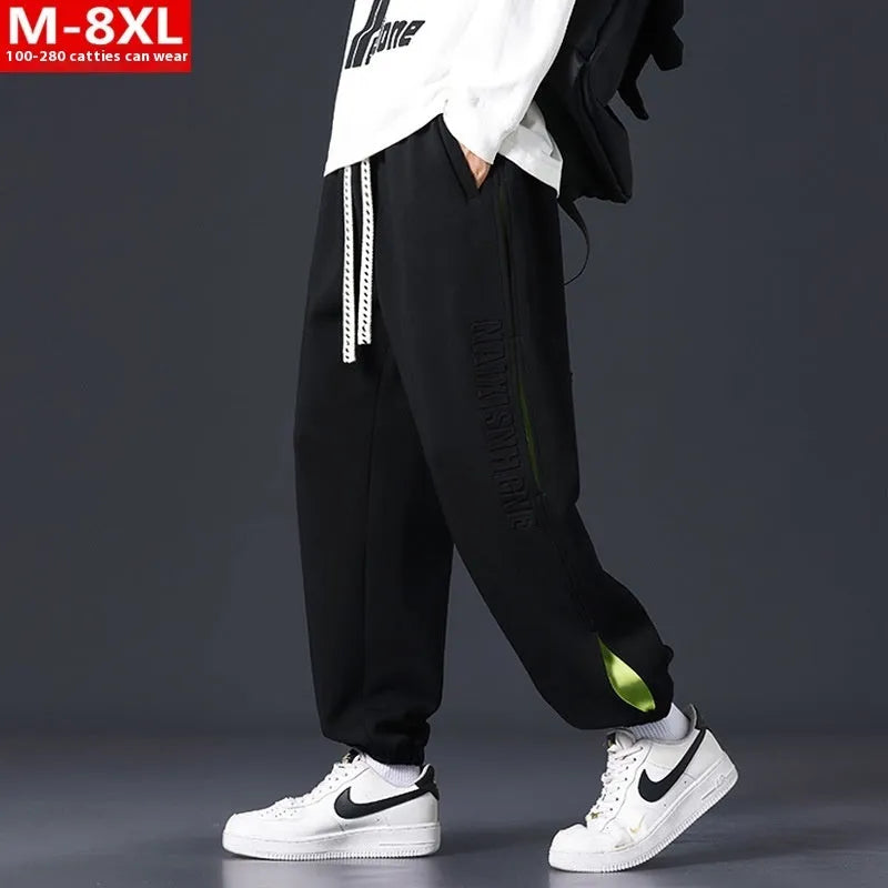 Men's cotton trousers with ankle bands and stitching detail in grey green colour