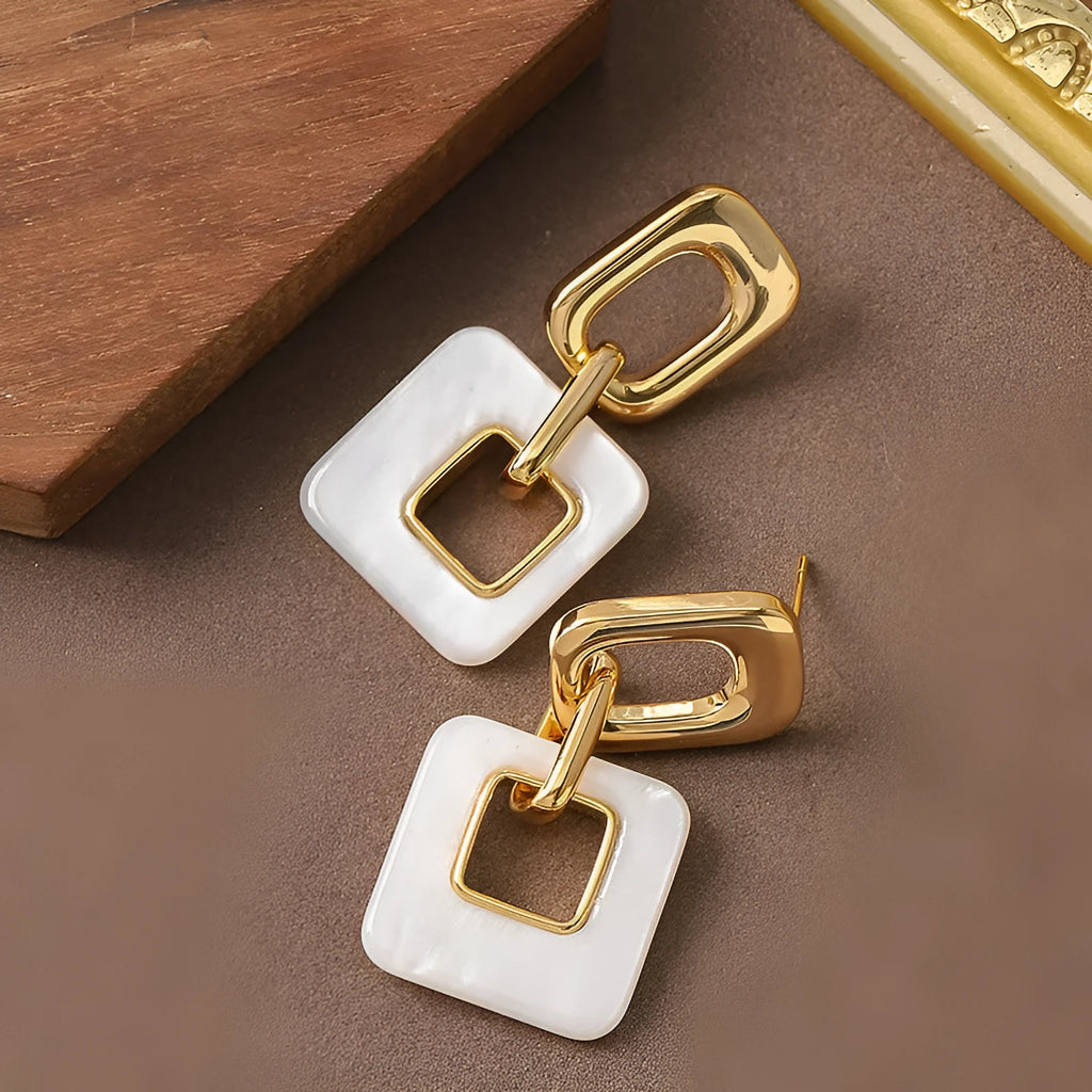 Hollow geometric square earrings in copper with electroplated finish and chamfered corners
