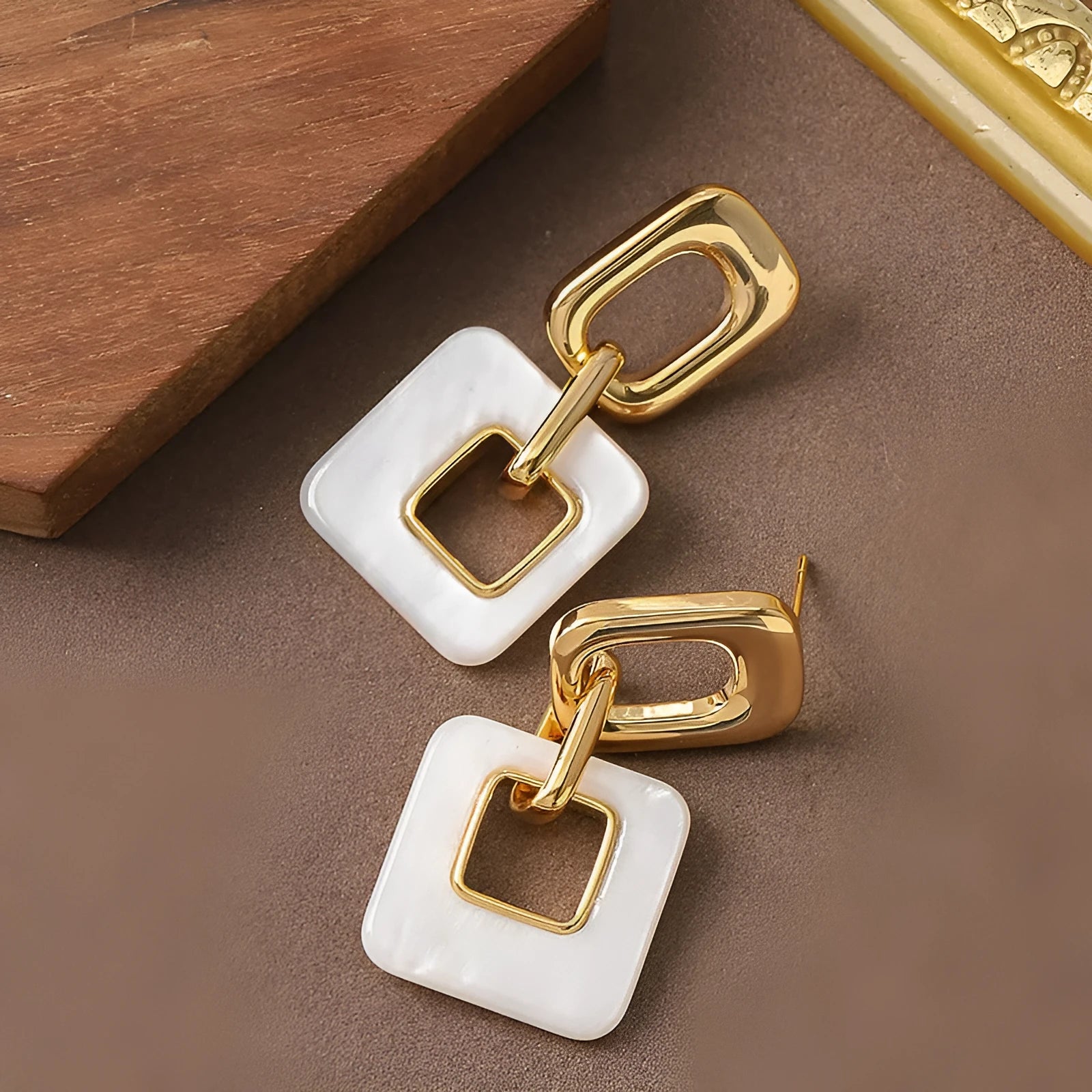 Hollow geometric square earrings in copper with electroplated finish and chamfered corners