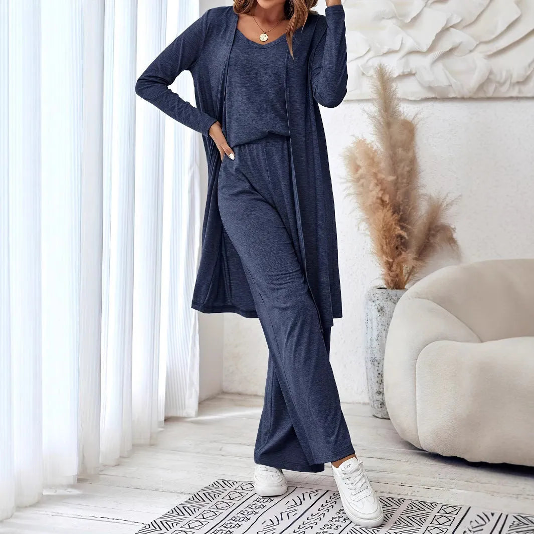 Blue women's three-piece suit set showing long cardigan, trousers, and sling top