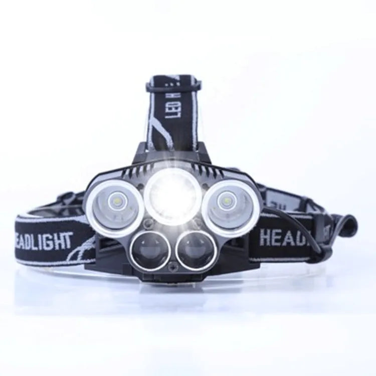Fixed focus camping head torch with long range beam on a headband, shown with its rechargeable battery and charger.