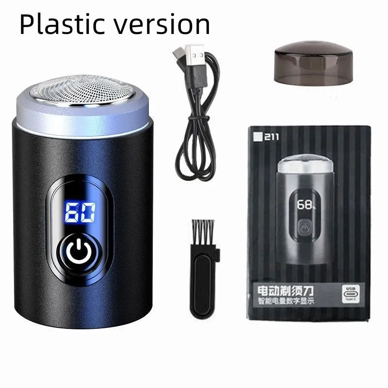 Black portable USB rechargeable shaver with cleaning brush and cable on a white background.