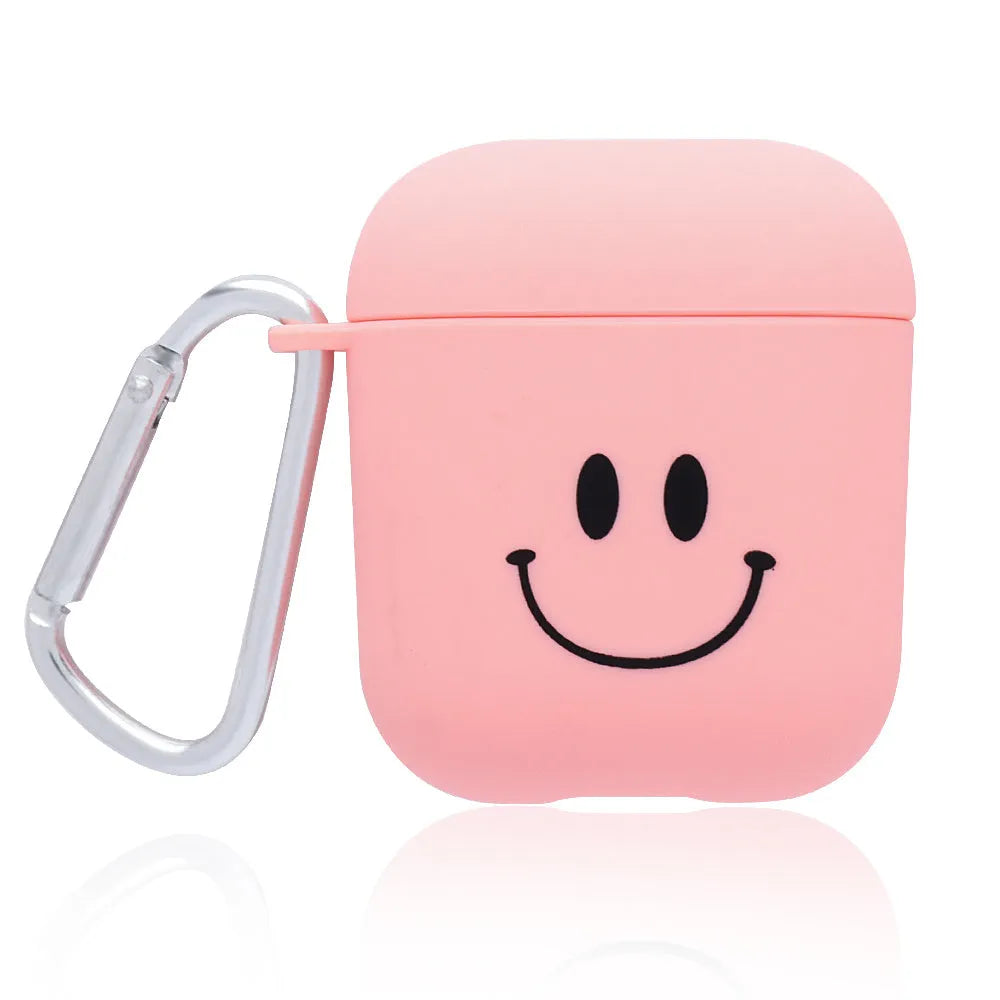 Black and pink AirPods case covers with smiley face and flower decorative motifs