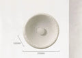 Japanese-style minimalist wall lamp with resin shade in three diameter sizes on white wall