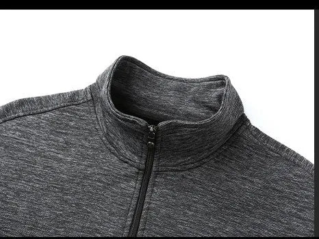 Men's black athletic fit zip-up jacket with a stand-up collar on a hanger