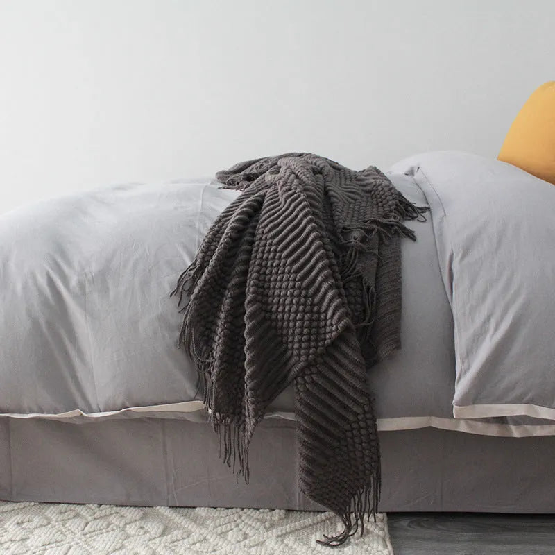 Small grey polyester nap blanket folded to show its 127x170cm size