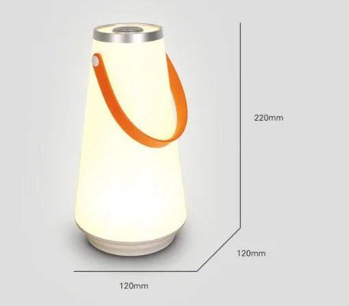White rechargeable LED night light lantern on bedside table measuring 12x12x22cm with warm light