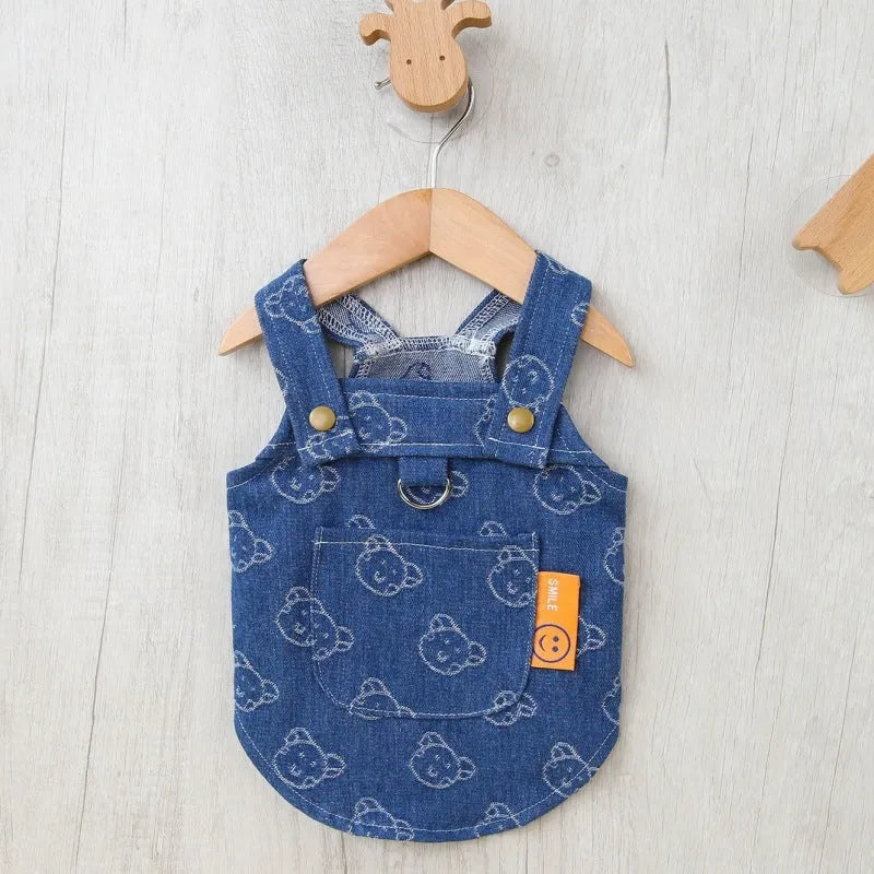 Small dog wearing denim princess dress with bracket skirt design