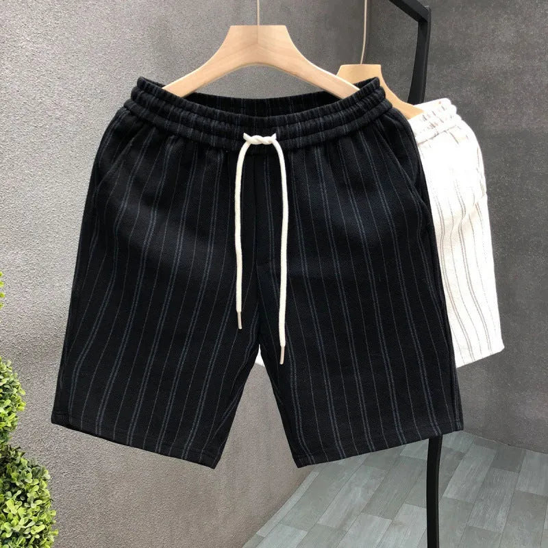 Men's black and white striped fleece-lined shorts with elastic waistband