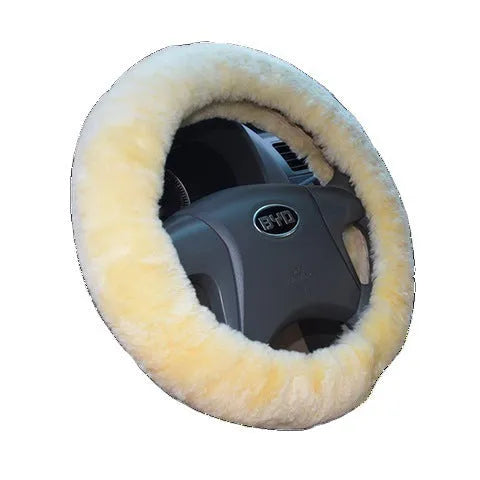 Wool steering wheel cover in black fitted on a car steering wheel, with matching handle cover visible