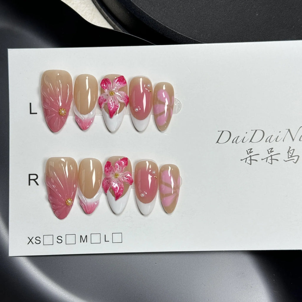 Plastic French style artificial nails with 3D lily and ice flower designs in almond shape, shown in multiple sizes.