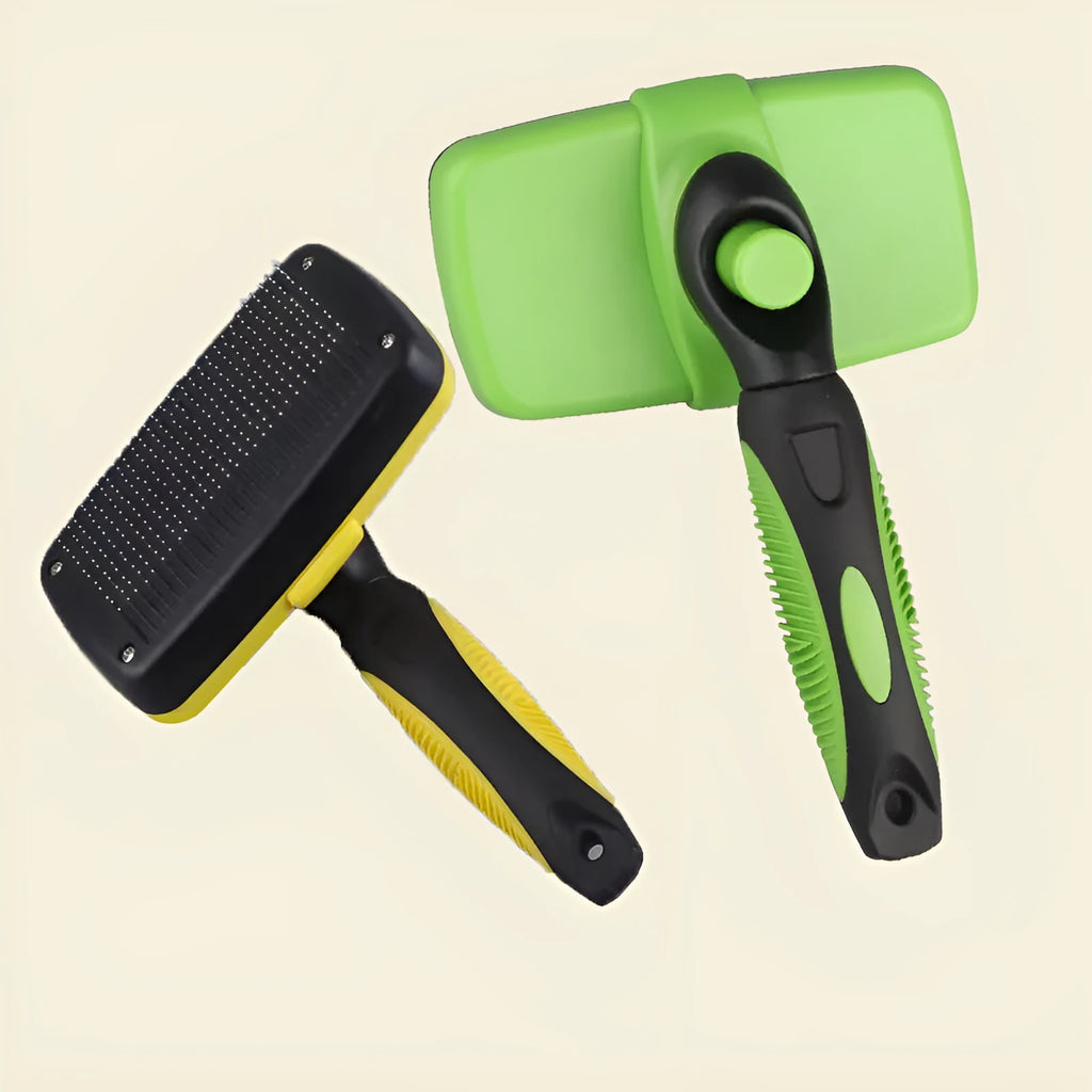 Green automatic retractable pet comb with stainless steel bristles on white background