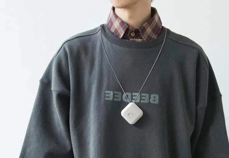 Compact pink USB air purifier necklace with negative ion technology and USB charging port