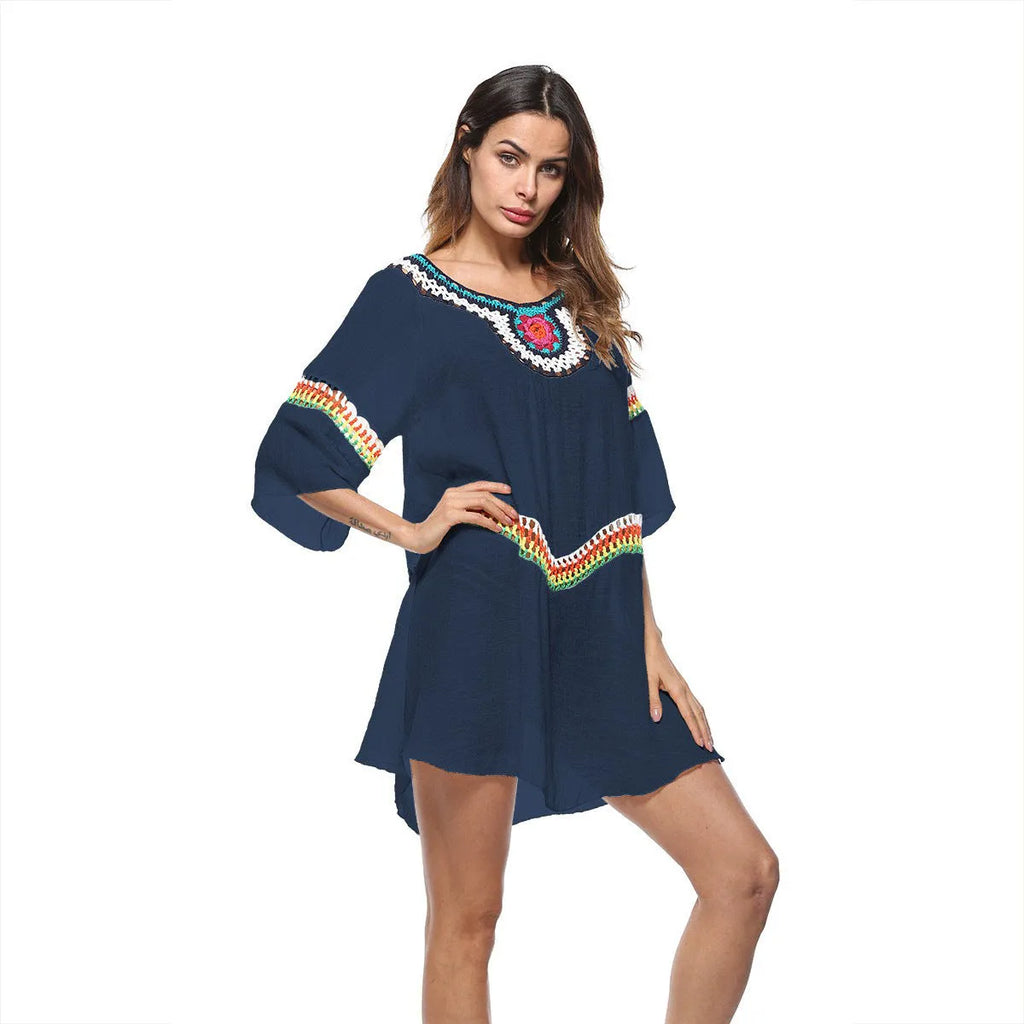 Crocheted ethnic style sun protection beach clothing for women in white, black, sapphire blue, or apricot.