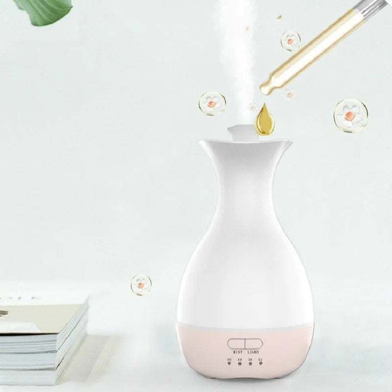 White ultrasonic humidifier diffuser with colourful LED night lights and mist output