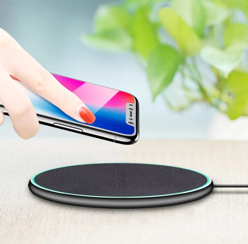 Black Qi wireless charging pad for iPhone 11 with rapid charging capability