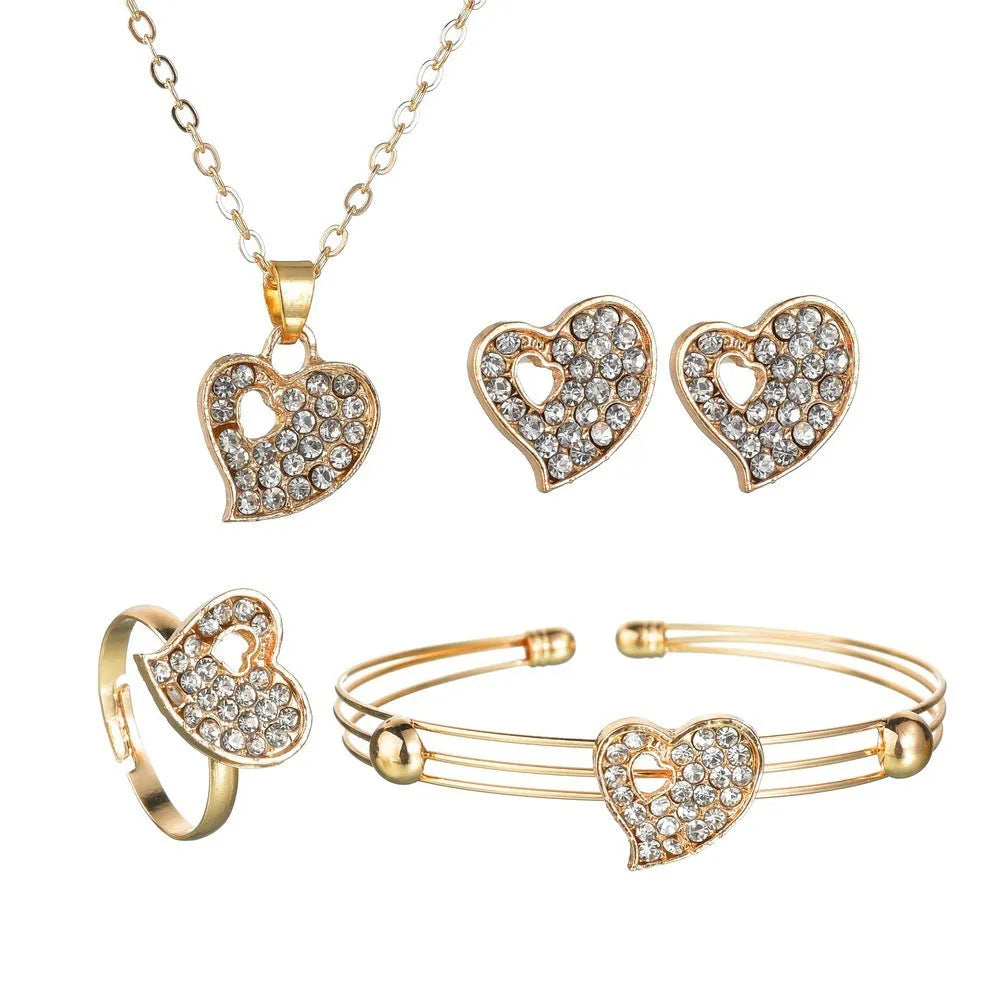 Women's gold alloy jewellery set with earrings, necklace featuring love pendant, and matching bracelet