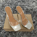 Women's black and silver high-heel boots with PVC soles on a size chart background.