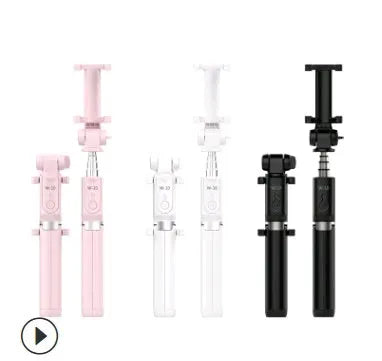 Black Bluetooth selfie stick tripod with remote control extended, holding a smartphone