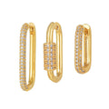 Three geometric ear clips with micro inlaid zircon detailing on copper in gold and white colours