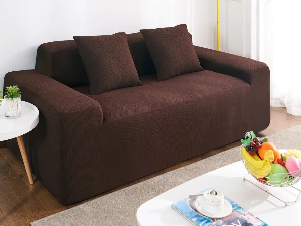 Waterproof polar fleece solid colour sofa slipcover with elastic bottom fitted on a 3-seat sofa in beige colour
