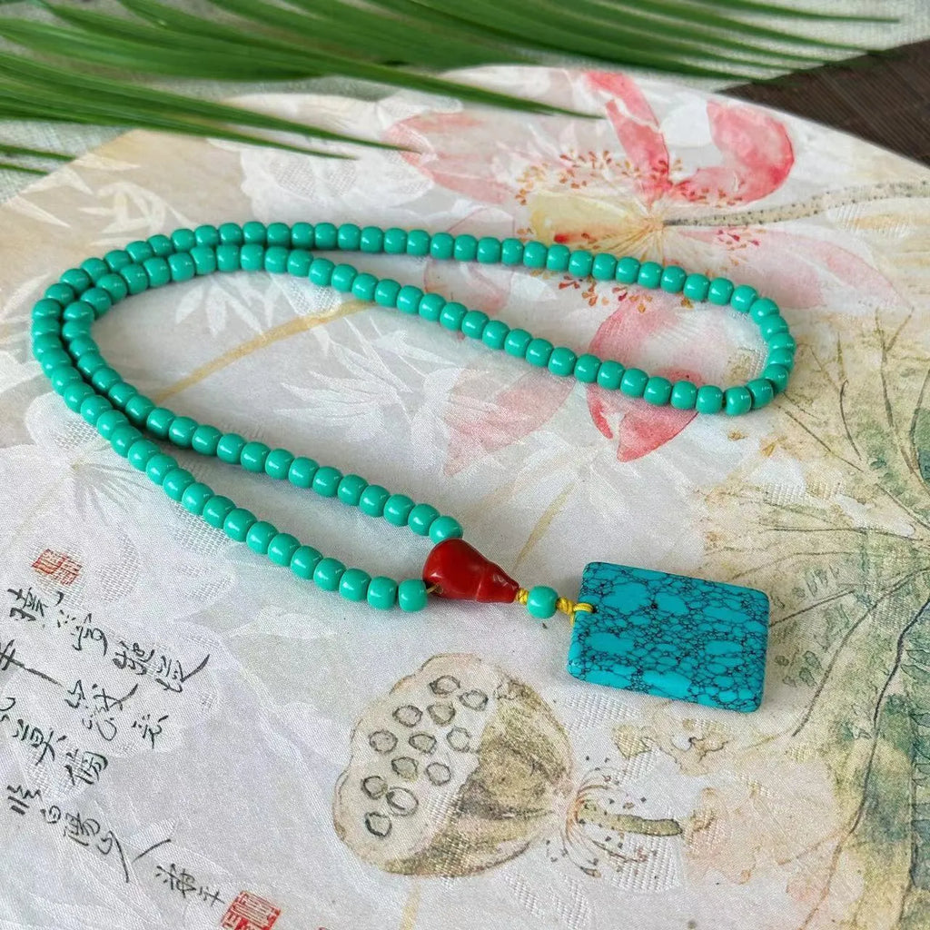 Turquoise mesh flower lucky pendant necklace on ball bead chain, hand-woven design