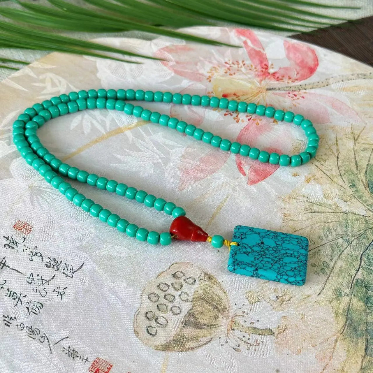 Turquoise mesh flower lucky pendant necklace on ball bead chain, hand-woven design