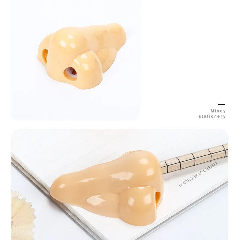 Flesh colour plastic pencil sharpener showing geometry design and large nostril hole