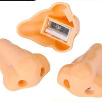 Flesh colour plastic pencil sharpener showing geometry design and large nostril hole