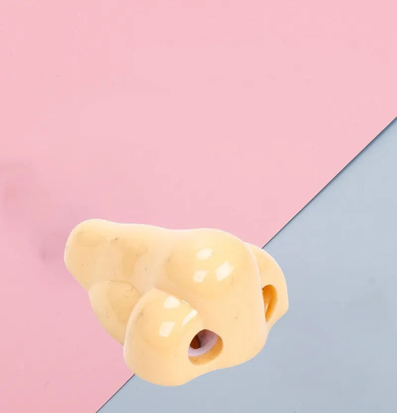 Flesh colour plastic pencil sharpener showing geometry design and large nostril hole