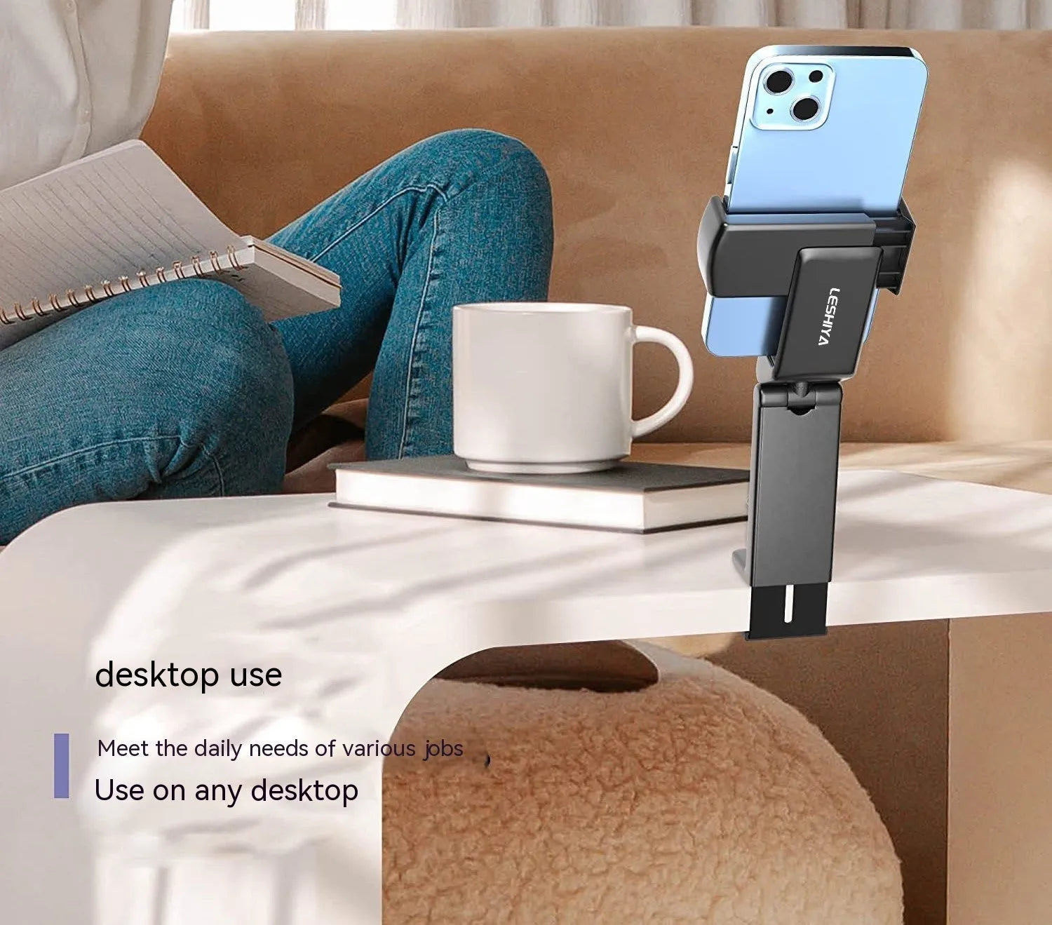 Black foldable phone holder with rotating mechanism shown holding a mobile phone at an angle
