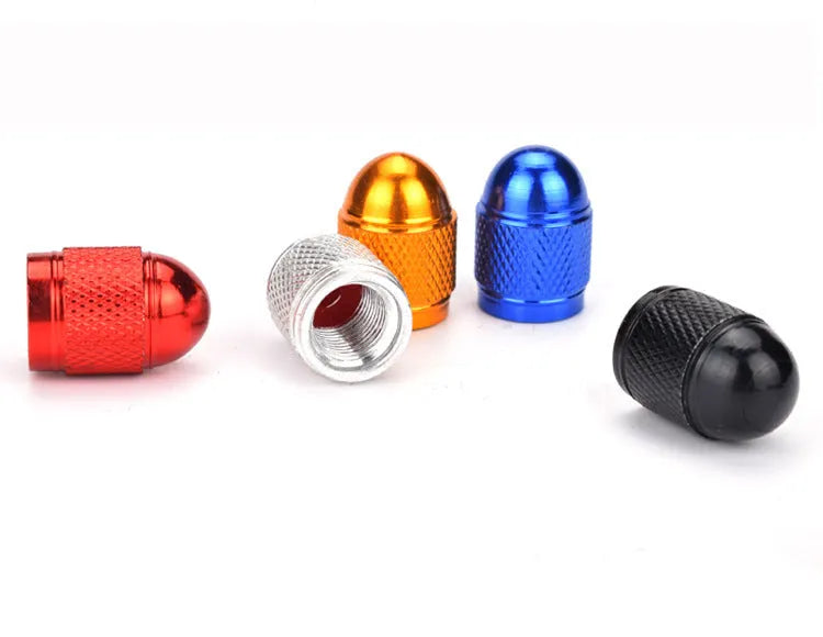 Anodised aluminium mountain bike tyre valve cap in one of five colours: black, blue, gold, red, or silver.