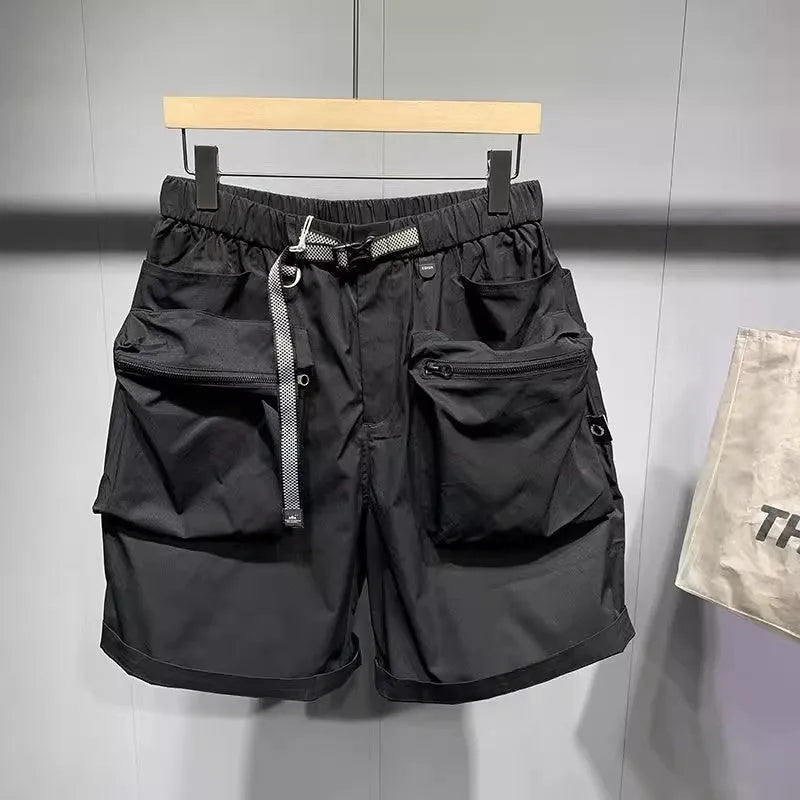 Man wearing large size loose fit black casual shorts with pockets.