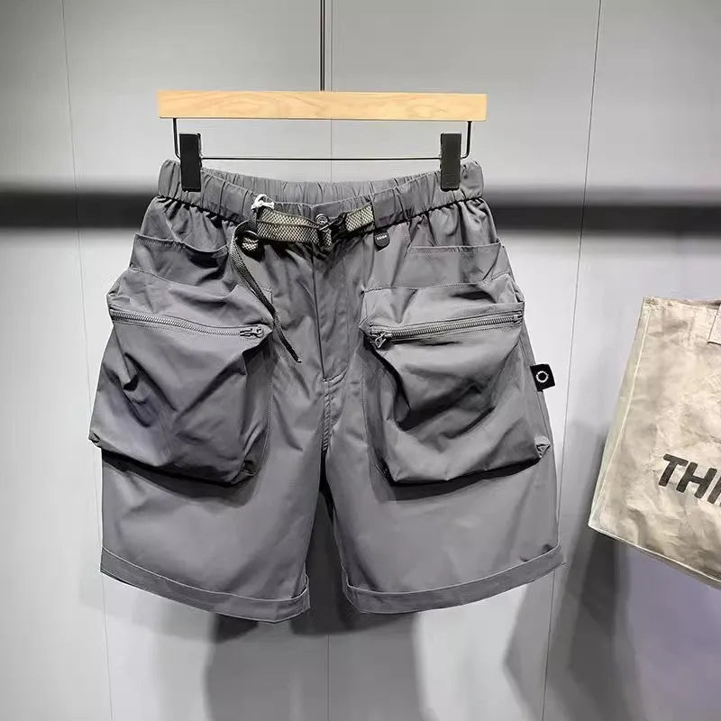 Man wearing large size loose fit black casual shorts with pockets.
