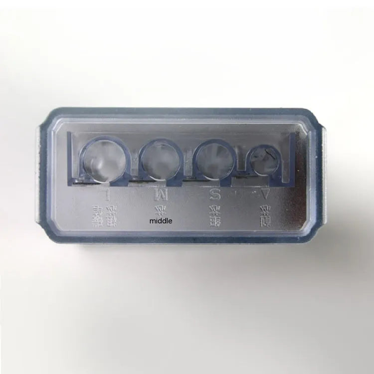 Geometric plastic pencil sharpener with four holes and included screwdriver tool on white background.
