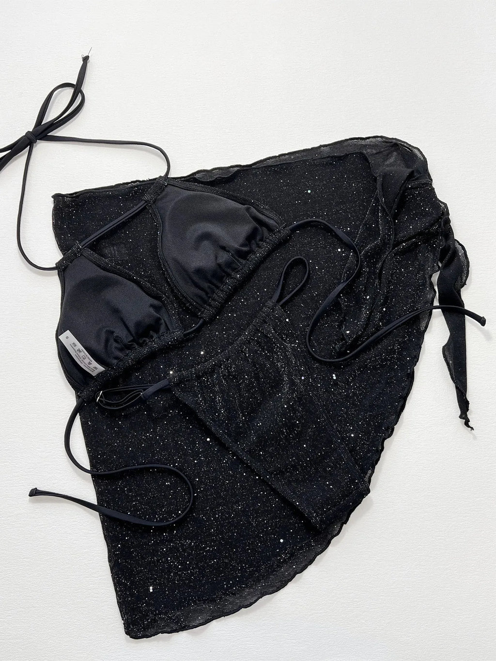 Black polyester bikini three-piece swimsuit set with triangle top and matching shorts