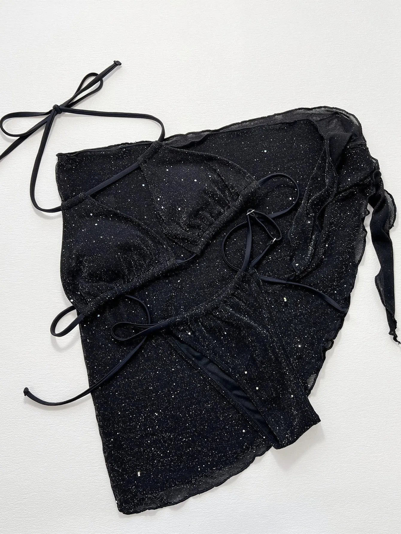 Black polyester bikini three-piece swimsuit set with triangle top and matching shorts