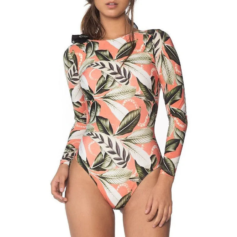 Women's green leaf print backless one-piece swimsuit on a mannequin.
