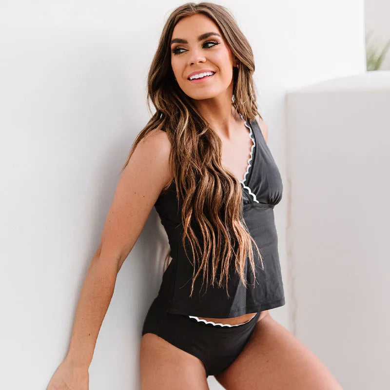 Black women's split swimsuit bikini on white background showing front view
