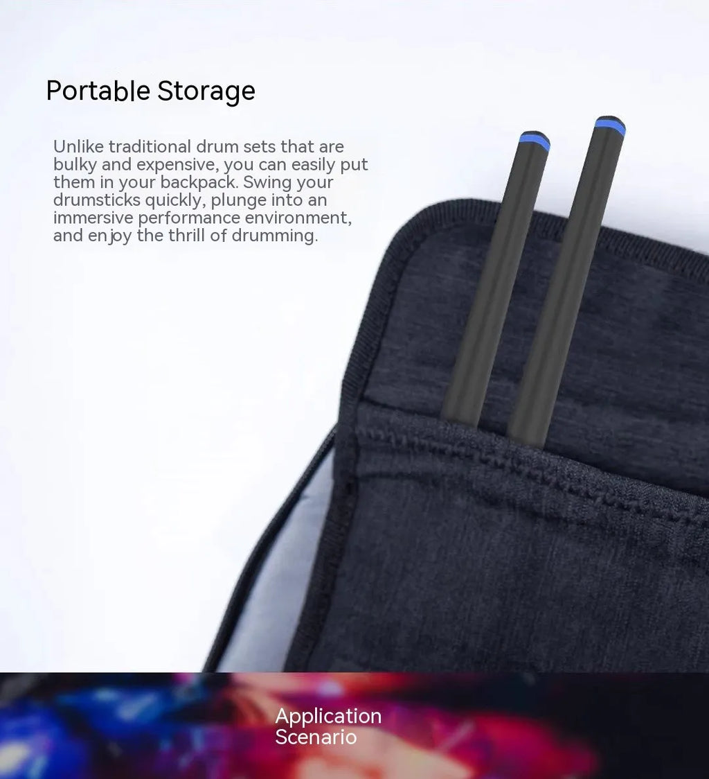 Black wireless air drum kit with two drumsticks, LED lighting, and USB-C charging cable