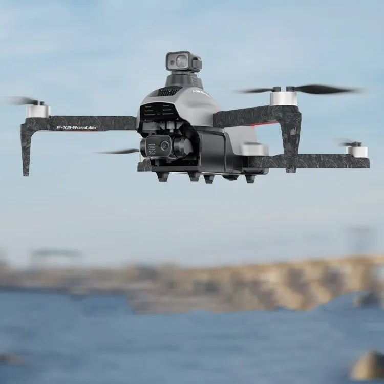 White folding quadcopter drone with camera, remote control, shoulder bag, and flight batteries on a neutral background.